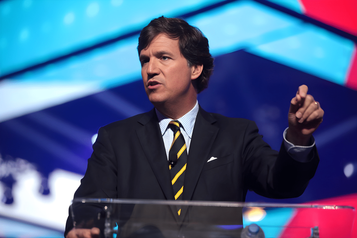 Reports of Tucker Carlson’s Waning Influence are Greatly Exaggerated - Photo of Tucker Carlson speaking at podium