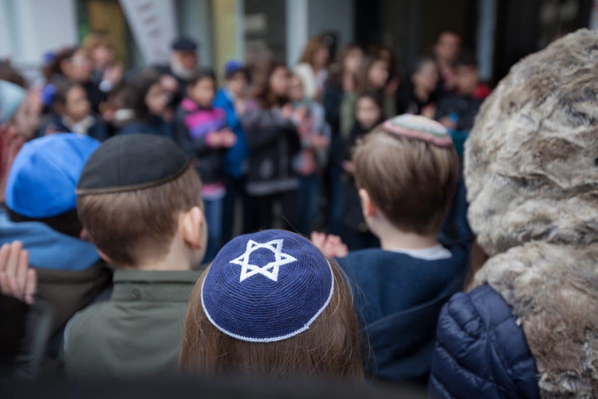 Jewish Children wearing Kippot at a community event.