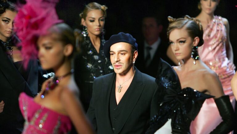 Fashion designer John Galliano walks the runway after his show.